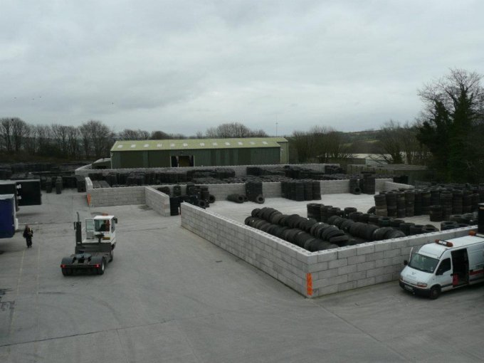Duo block material storage bays filled with stock across an open yard