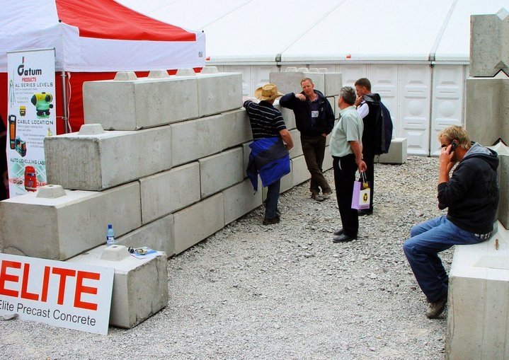 Duo interlocking blocks stacked as an exhibition display with visitors alongside