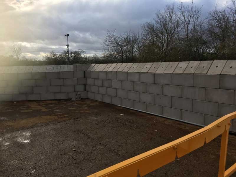 Legato block bay walls finished with a course of flat capping top blocks