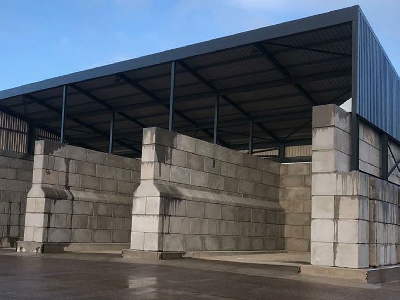 Interlocking block storage bays built beneath an open steel canopy
