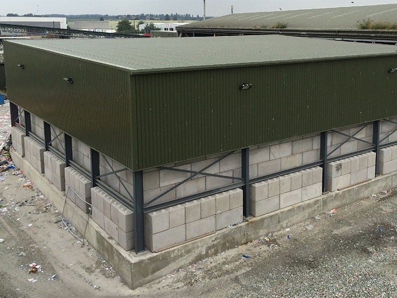 Legato block walls forming the base of a clad industrial building