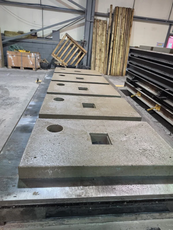 Heat pump base slabs being produced on a casting bed in the workshop
