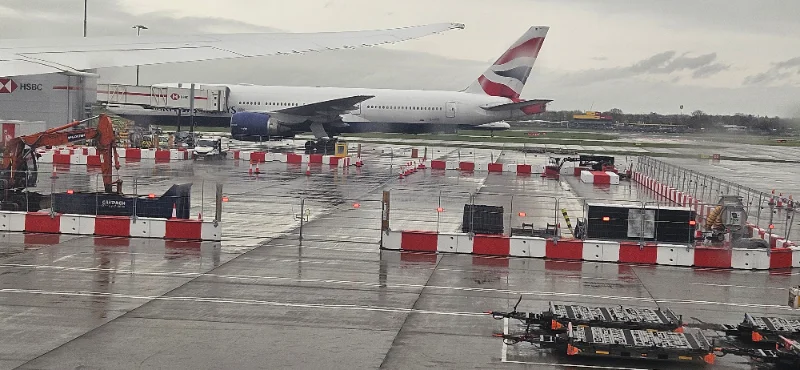 TVCB barriers lining an airport apron with an aircraft behind